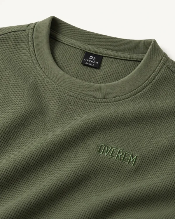 89cb7b0f-b6c3-4d83-9f0d-c0384d99be8e Polera clásica de tela galleta verde